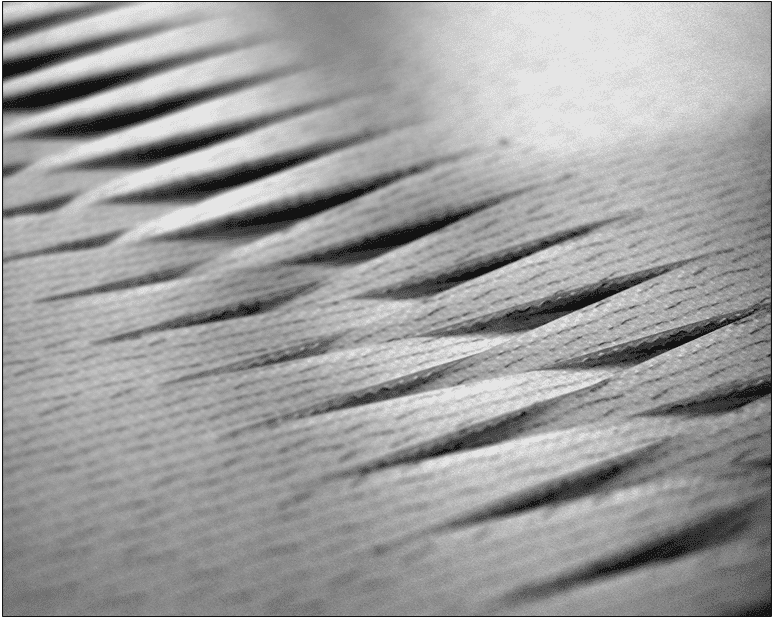 Close view of conveyor belt surface and joint area