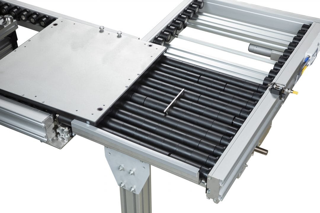 Powered roller transfer beside a conveyor section