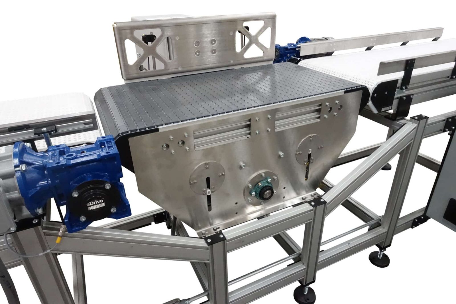 Heavy-duty conveyor system with automated pusher