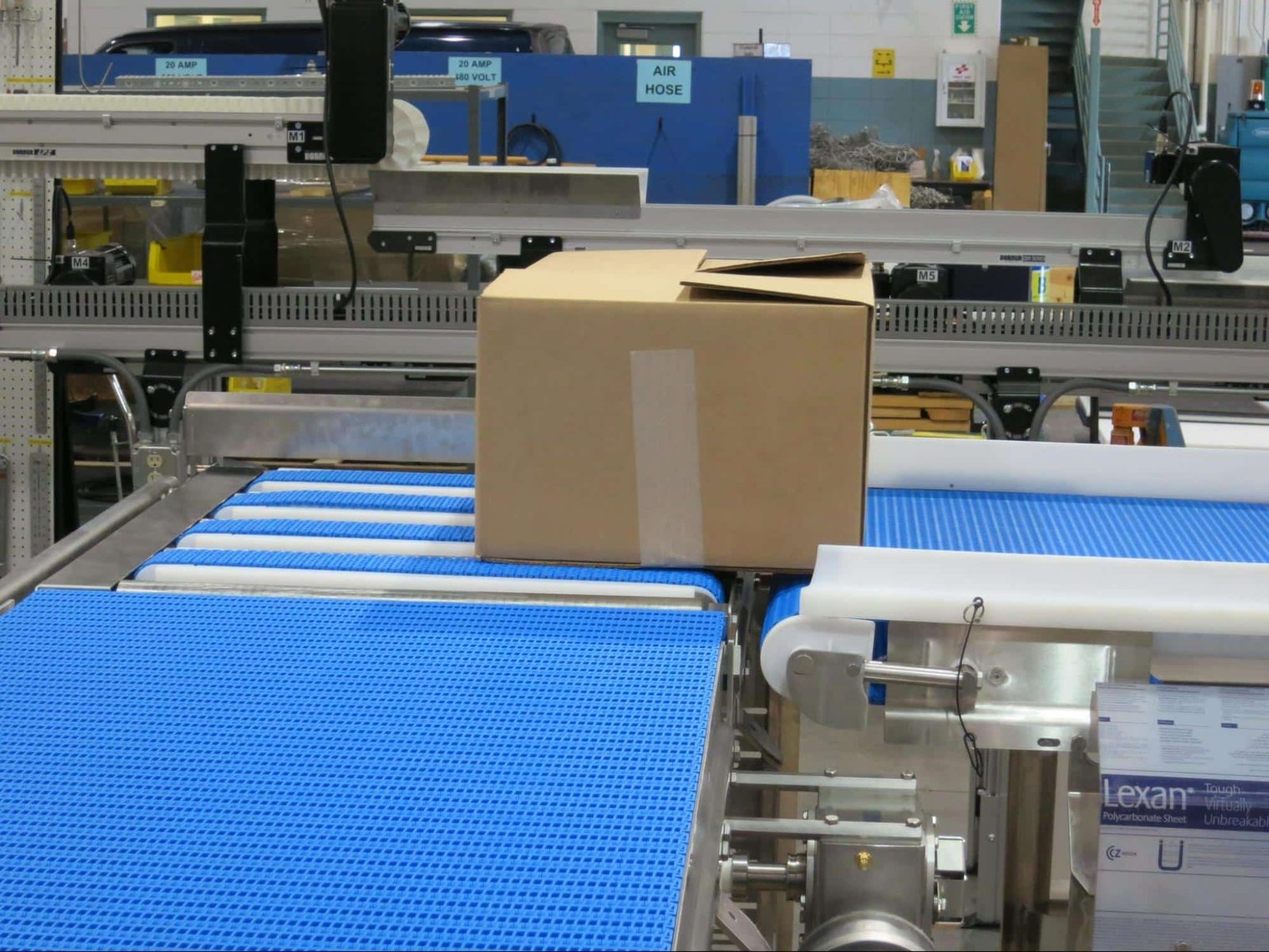 Box moving along a conveyor for labeling