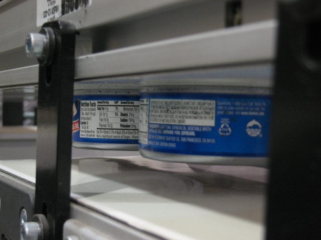 Magnetic conveyor carrying parts up an incline