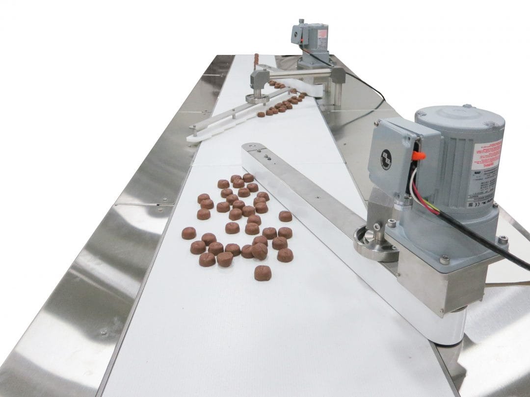 Multiple conveyor lines merging into a production path