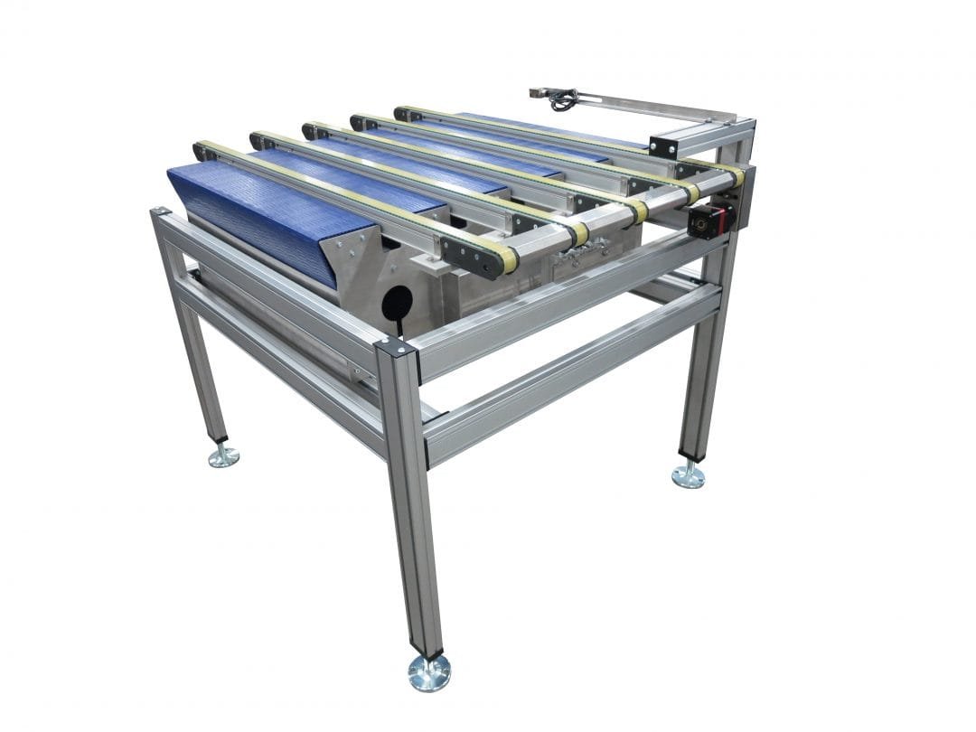 Pop-up transfer installed within a conveyor line