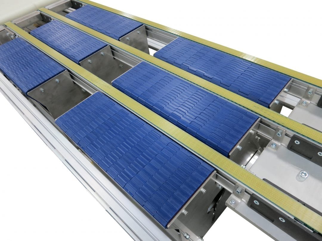Pop-up transfer section raised between two perpendicular conveyors
