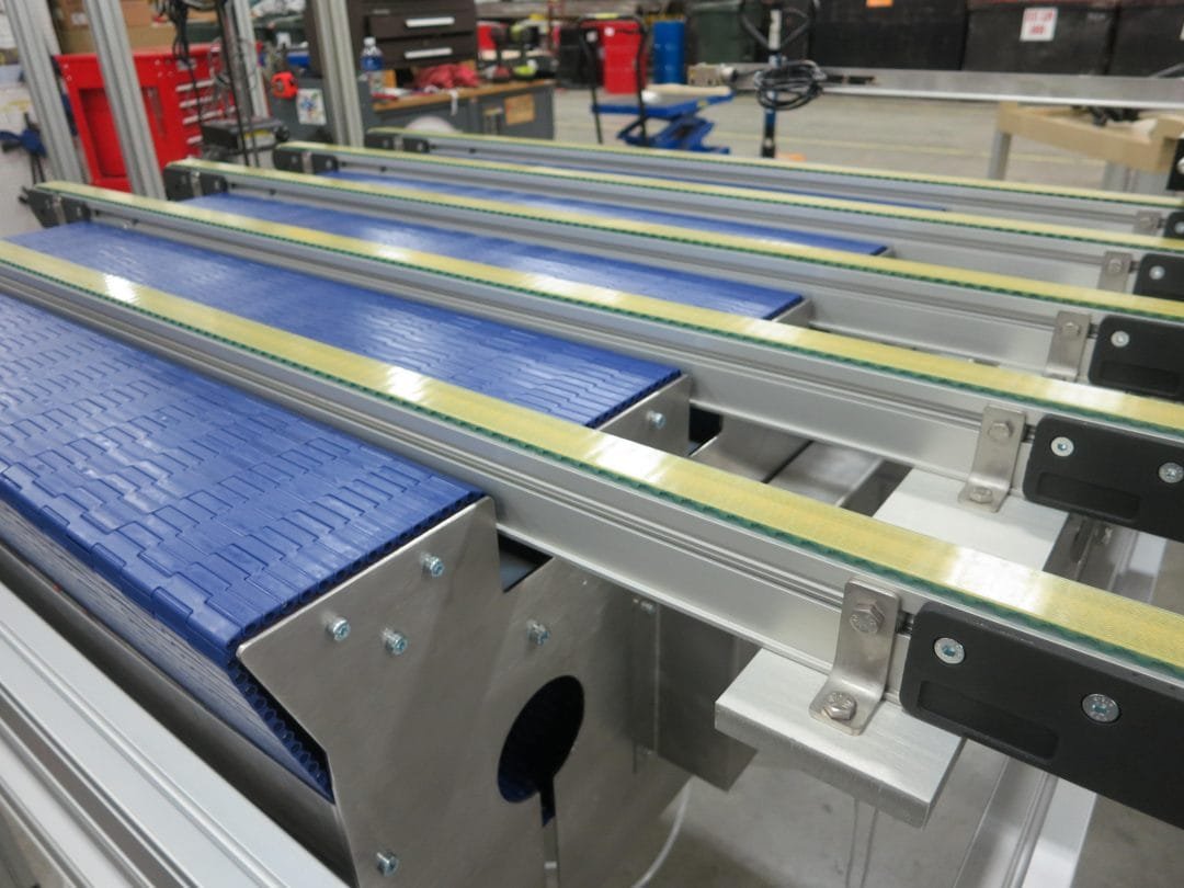 Conveyor system controlling a product transfer