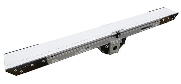 Perforated vacuum conveyor belt over a slotted bed plate